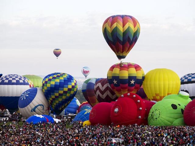 Several balloons that took off in the morning later landed in a nearby park where balloon chase crews were poised to retrieve them. One of the big draws of the balloon fiesta is the ability of spectators to roam the city’s 72-acre (29-hectare) balloon park to watch the morning mass ascensions. (REUTERS)
