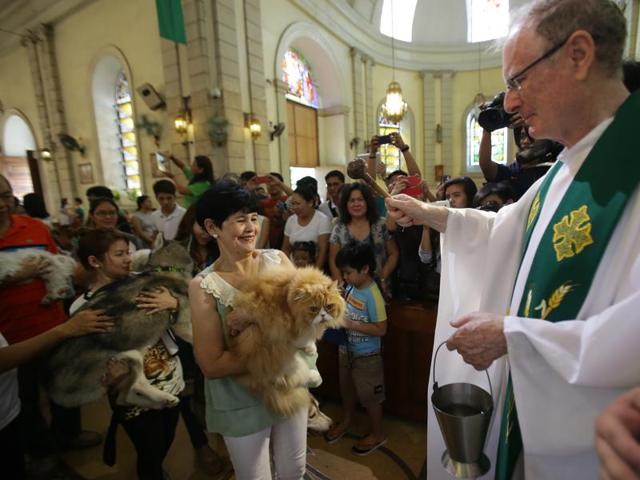 Several Filipinos brought their pets to be blessed during the annual event which is also done to celebrate the feast day of St. Francis of Assisi, the patron saint of animals and ecology. (AP)