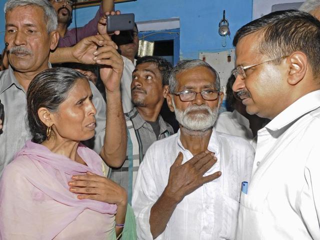 Delhi chief minister Arvind Kejriwal meets the family of Mohammad Ikhlaq who was killed and his son critically injured by a mob over an allegation of cow slaughtering on September 28, in Bisada village in Greater Noida, India. (Burhaan Kinu / Hindustan Times)