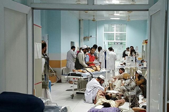 In this undated photograph released by Medecins Sans Frontieres (MSF), Afghan medical personnel treat civilians injured following an offensive against Taliban militants by Afghan and coalition forces at the MSF hospital in Kunduz. (AFP Photo)