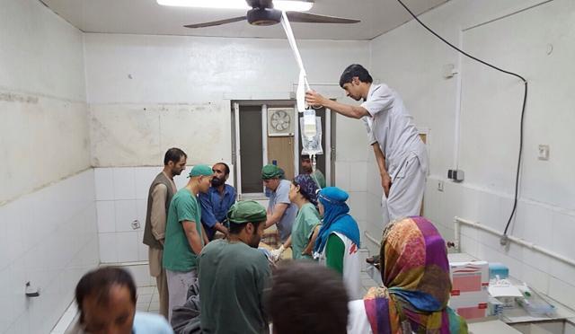 In this photograph released by Medecins Sans Frontieres (MSF) on October 3, Afghan MSF surgeons work in an undamaged part of the MSF hospital in Kunduz. (AFP/MSF)
