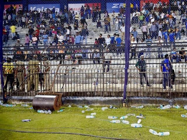 Water bottles thrown by the crowd are seen lying on the ground. (PTI Photo)