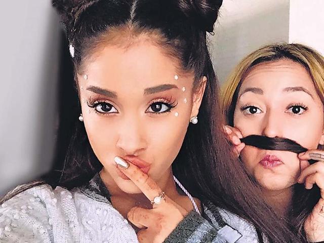 Singer Ariana Grande sporting twin braided knots while Vanessa Hudgens does Princess Leia double buns. Singer Ariana Grande sporting twin braided knots while Vanessa Hudgens does Princess Leia double buns.