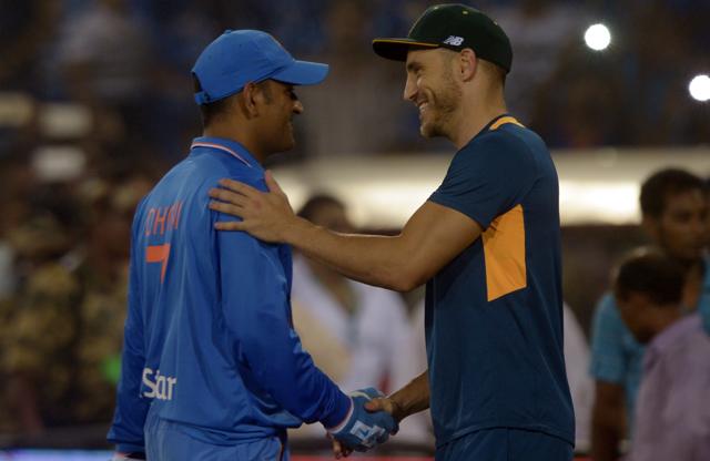 South Africa's captain Faf du Plessis (R) shakes hands with Mahendra Singh Dhoni after South Africa won the second T20 cricket match between India and South Africa at the Barabati Stadium in Cuttack. (AFP)