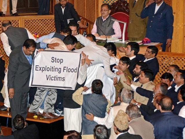 Unruly scenes were witnessed in the J-K assembly opposition members stormed the well of the House demanding adjournment of question hour to discuss various issues.(PTI)