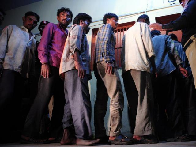 Arrested Indian fishermen being paraded at a police lock up in Karachi. (AFP)