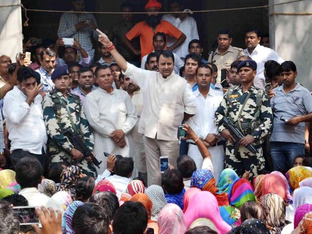 BJP MLA Sangeet Som addressing a public meeting despite prohibitory orders, in Bisdada village, Dadri on Sunday.(HT Photo)
