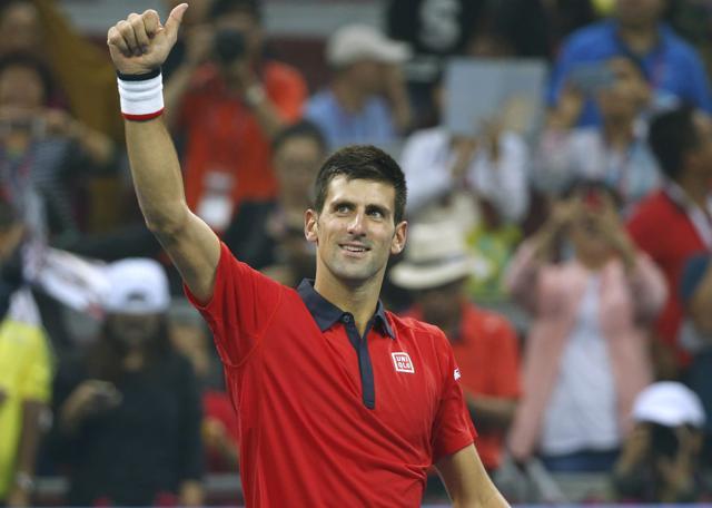 Novak Djokovic of Serbia reacts after winning against Simone Bolelli of Italy in their first round match of the China Open in Beijing, on October 6, 2015. (Reuters Photo)