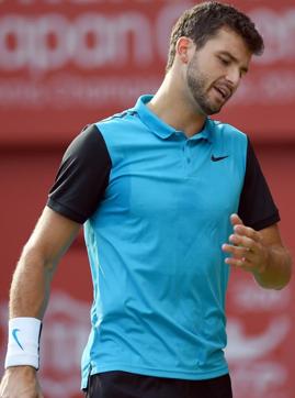Grigor Dimitrov of Bulgaria reacts after losing a point against Benoit Paire of France during their first round match in the Japan Open tennis tournament in Tokyo on October 6, 2015. AFP PHOTO / Toru YAMANAKA (AFP) Grigor Dimitrov of Bulgaria reacts after losing a point against Benoit Paire of France during their first round match in the Japan Open tennis tournament in Tokyo on October 6, 2015. AFP PHOTO / Toru YAMANAKA (AFP)