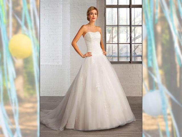 Dress by Cosmobella - Collection 2016. A princess-style bustier dress in lace and tulle with a short train. Lace-up back. (AFP Photo)