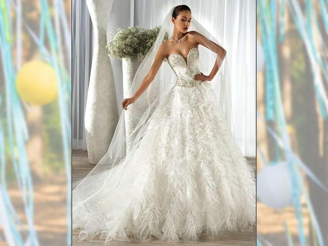 Dress by Demetrios - Collection 2016. Long princess-style dress comprised of a pearled plunging-neckline bustier and a feathery tulle skirt. (AFP Photo)