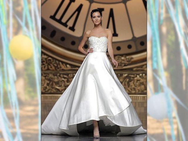 The Vitality dress by Atelier Pronovias - Collection 2016. Princess-style wedding dress in lace and Mikado Silk, with a bustier and a short-front, long-back voluminous skirt and narrow belt. (AFP Photo)