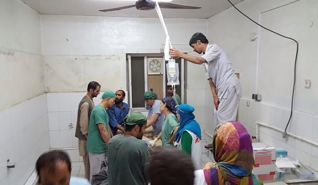 In this photograph released by Medecins Sans Frontieres (MSF) on October 3, 2015, Afghan MSF surgeons work in an undamaged part of the MSF hospital in Kunduz after the operating theatres were destroyed in an air strike. (AFP Photo/MSF) In this photograph released by Medecins Sans Frontieres (MSF) on October 3, 2015, Afghan MSF surgeons work in an undamaged part of the MSF hospital in Kunduz after the operating theatres were destroyed in an air strike. (AFP Photo/MSF)