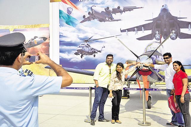 Spectators click pictures with the aircraft kept on display at Hindon air base. (Sakib Ali/HT Photo) Spectators click pictures with the aircraft kept on display at Hindon air base. (Sakib Ali/HT Photo)