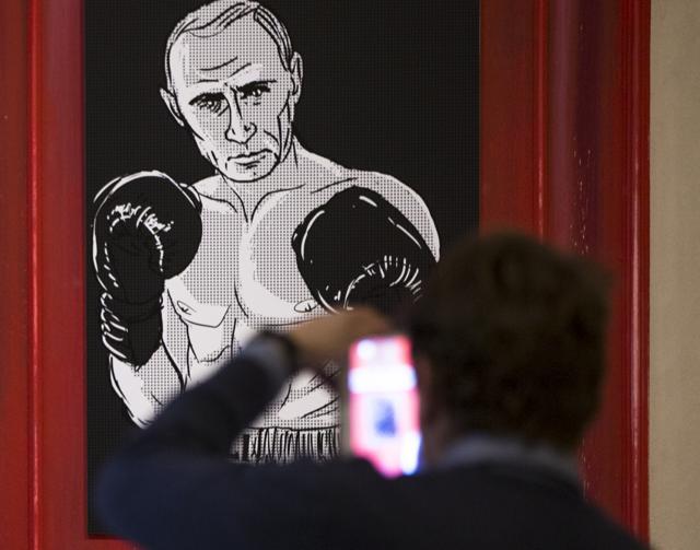 Artists have drawn the Russian president using 30 heroic themes originating from different countries and world epochs at a two-day exhibition in Moscow. Russian President Vladimir Putin celebrated his 63rd birthday on Wednesday. (AP Photo)