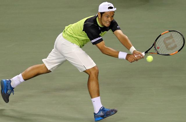 Tatsuma Ito returns a shot against Stan Wawrinka at the Japan Open in Tokyo, on October 7, 2015. (AP)