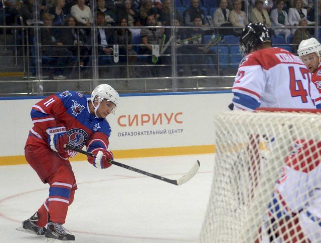 Russian President Vladimir Putin spent his 63rd birthday on the ice, playing hockey with NHL stars against Russian officials and tycoons. (AP Photo)