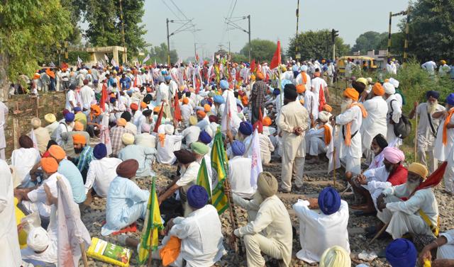 Farmers gather in numbers to block railway tracks in their protest against the punjab and central government. (Sameer sehgal/ ht photo)