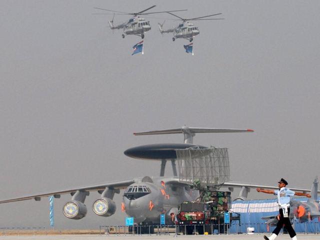 An IAF jawan marches past a C-17 Globemaster plane during the full dress rehearsal for the Air Force Day function at the Hindon air force station in Ghaziabad. (PTI Photo)