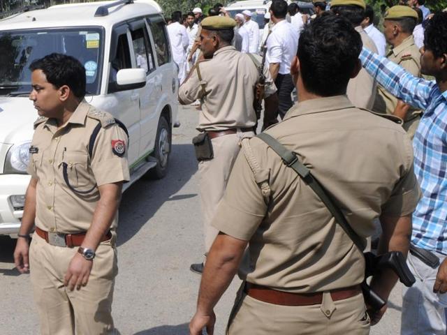 A police team patrols outside the house of Mohmmad Ikhlaq who was killed by a mob over an allegation of cow slaughtering late night on September 28, at Bisada village, in Greater Noida.(Burhaan Kinu/ HT Photo)