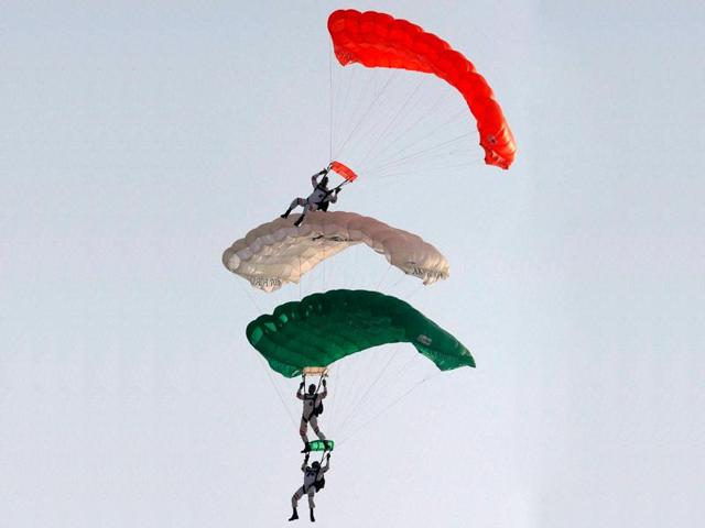 Indian Air Force paratroopers of the Akash Ganga team glide in to land during full dress rehearsal for the Air Force Day parade at Hindon air force station, in Ghaziabad. (AFP Photo)