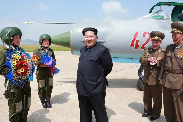 North Korean leader Kim Jong-Un (C) with first female fighter jet pilots Jo Kum Hyang and Rim Sol. (AFP) North Korean leader Kim Jong-Un (C) with first female fighter jet pilots Jo Kum Hyang and Rim Sol. (AFP)