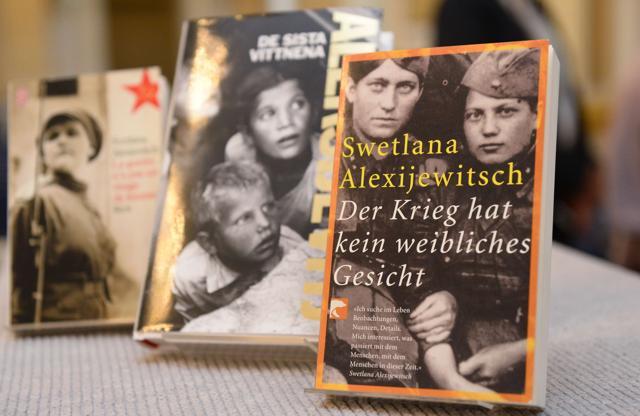 Books of Belarussian writer Svetlana Alexievich translated in different languages are on display at the Swedish Academy in Stockholm. (AFP Photo)