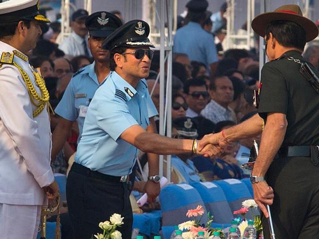 Legendary cricketer and honorary Indian Air Force (IAF) officer Sachin Tendulkar shakes hand with Indian Army chief Dalbir Singh Suhag during the Air Force Day parade at Hindon air force base near New Delhi. (AP Photo)