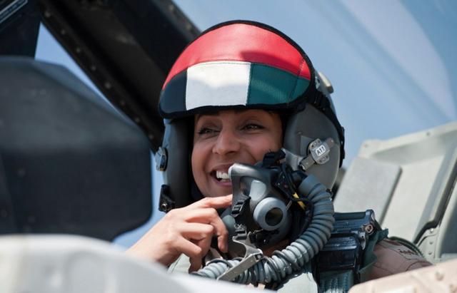Major Mariam al-Mansouri, the first female pilote to join the Emirates Air Forces, gesturing as she sits in the cockpit of her F-16 fighter jet. (AFP) Major Mariam al-Mansouri, the first female pilote to join the Emirates Air Forces, gesturing as she sits in the cockpit of her F-16 fighter jet. (AFP)