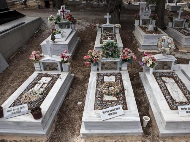 The graves of a Syrian Christian Orthodox family who drowned at sea during an attempt to cross a part of the Aegean Sea from the Turkish coast, are seen at the Saint Panteleimon cemetery of Mytilene, on the Greek island of Lesbos. (REUTERS) The graves of a Syrian Christian Orthodox family who drowned at sea during an attempt to cross a part of the Aegean Sea from the Turkish coast, are seen at the Saint Panteleimon cemetery of Mytilene, on the Greek island of Lesbos. (REUTERS)