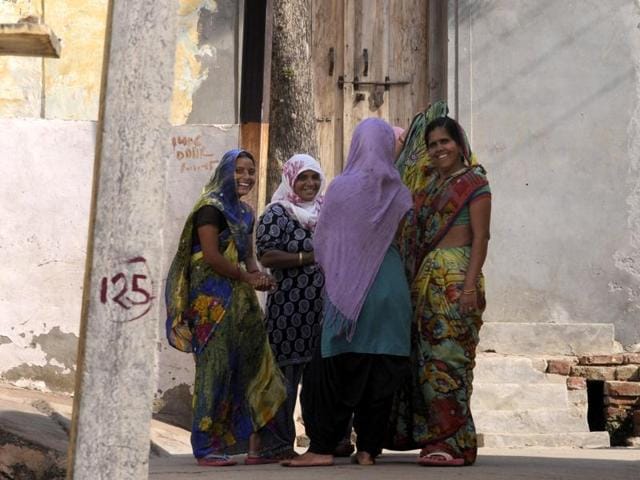 Women talk to each other in Bisada village. (Sunil Ghosh / HT Photo)