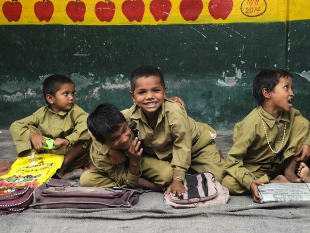 Children at a primary school in Dadri area have a good time. (Sunil Ghosh / HT Photo)