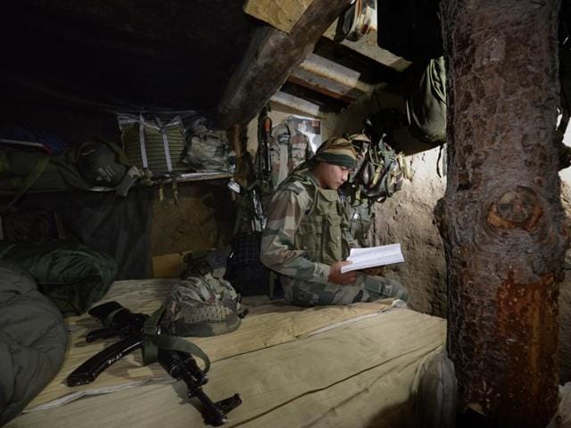 Indian Army Rifleman Anurag Thapa studies in his bunker in a forward post at the India-Pakistan LOC in Saujian area near Poonch. (Gurinder Osan / Hindustan Times) Indian Army Rifleman Anurag Thapa studies in his bunker in a forward post at the India-Pakistan LOC in Saujian area near Poonch. (Gurinder Osan / Hindustan Times)