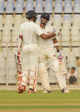 Mumbai captain Aditya Tare celebrates after completing his century against Punjab at Wankhede Stadium in Mumbai on Friday. (Prakash Parsekar)