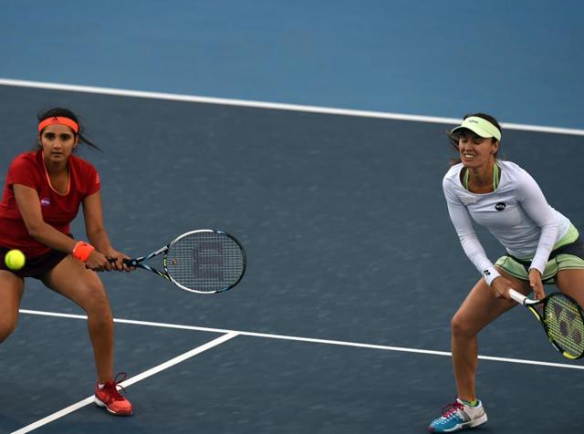 Sania Mirza, left, of India hits a return as partner Martina Hingis of Switzerland watches in their semifinal match against Liang Chen and Wang Yafan of China at the China Open in Beijing, on October 9, 2015. (AFP Photo) Sania Mirza, left, of India hits a return as partner Martina Hingis of Switzerland watches in their semifinal match against Liang Chen and Wang Yafan of China at the China Open in Beijing, on October 9, 2015. (AFP Photo)