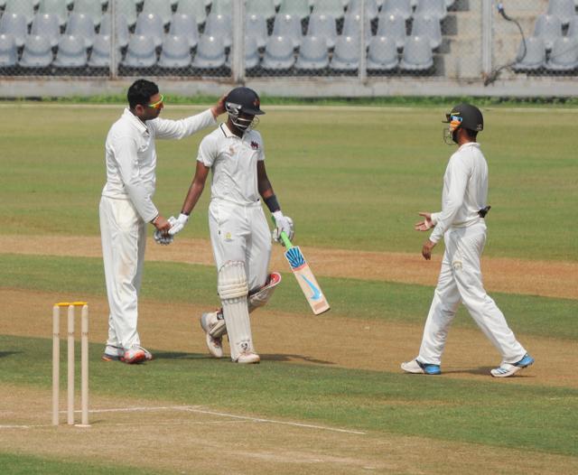 Punjab's Yuvraj Singh (left) congratulates Mumbai's Shreyas Iyer after he reached 200 in the Ranji Trophy match at Wankhede Stadium in Mumbai on Friday. (Prakash Parsekar)
