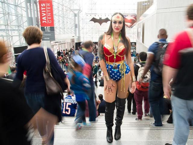 An attendee dressed as Wonder Woman walks the floor of New York Comic Con at the Javits Center. (AP)