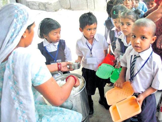 Students line up to receive their mid-day meals at a government school in New Delhi. (HT file photo) Students line up to receive their mid-day meals at a government school in New Delhi. (HT file photo)