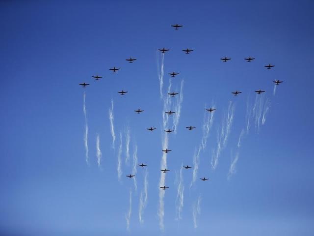 Airplanes form the symbol of the Workers' Party of Korea during the parade. (REUTERS)