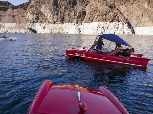 Two Amphicars taking part in the show. The German-made Amphicar was produced from 1961-1968. (REUTERS)