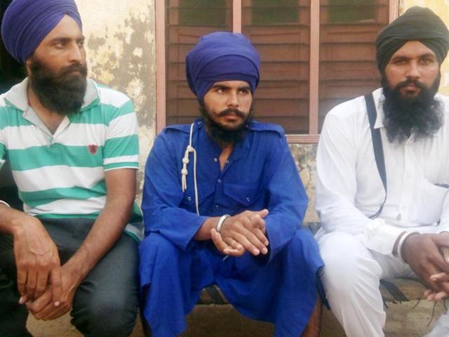 Joga Singh (C) who attacked Kesgarh Sahib jathedar along with his family members in Amritsar on Saturday.(HT Photo)