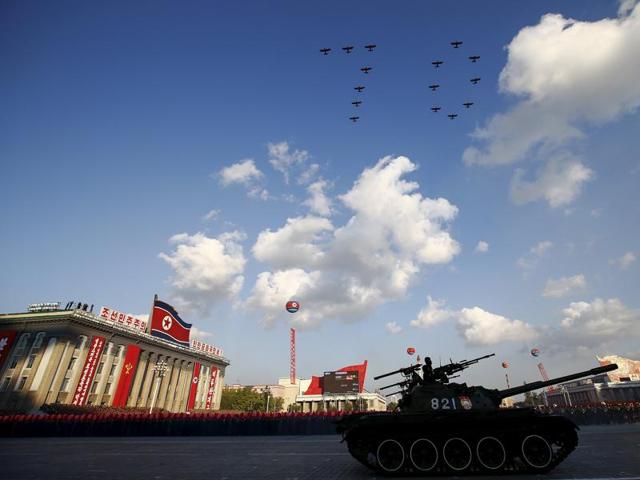 Planes form the number "70" as they fly over Pyongyang's main Kim Il Sung Square during the parade celebrating the 70th anniversary of the founding of the ruling Workers' Party of Korea. (REUTERS)