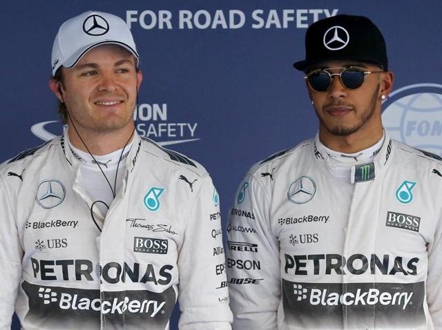 Mercedes Formula One driver Nico Rosberg of Germany and his team mate Lewis Hamilton (R) of Britain, celebrate after qualifying for the pole and second position respectively for the Russian F1 Grand Prix in Sochi. (REUTERS) Mercedes Formula One driver Nico Rosberg of Germany and his team mate Lewis Hamilton (R) of Britain, celebrate after qualifying for the pole and second position respectively for the Russian F1 Grand Prix in Sochi. (REUTERS)