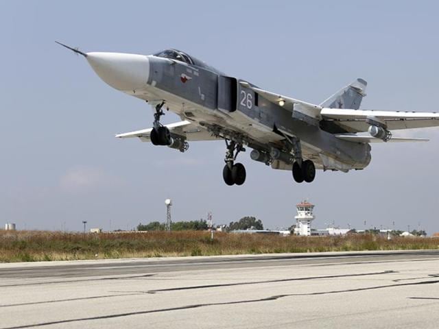 A frame grab taken from footage released by Russia's Defence Ministry October 9, 2015, shows what Russia says is a target site shortly before airstrikes carried out by the Russian air force on headquarters of Liwa Al-Haqq militant group near Raqqa, Syria(REUTERS Photo)