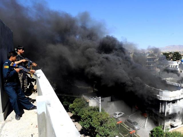 Afghan security policemen stands guard on a rooftop as smoke rises following an attack by insurgents on the Indian consulate in Herat. (AFP File Photo) Afghan security policemen stands guard on a rooftop as smoke rises following an attack by insurgents on the Indian consulate in Herat. (AFP File Photo)