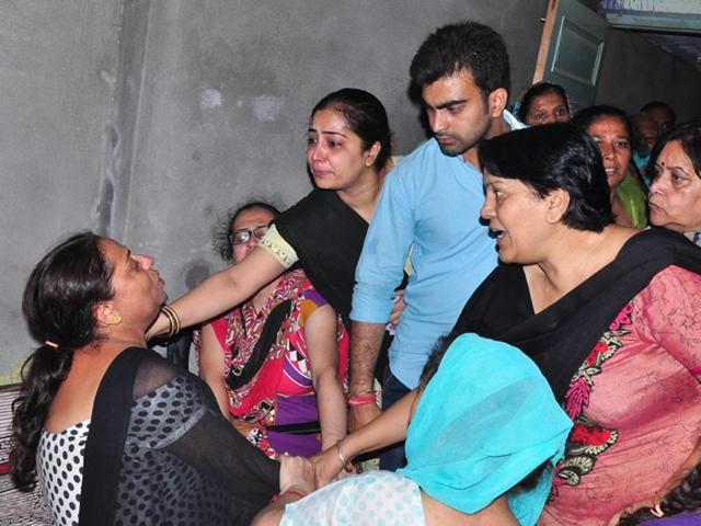 Relatives consoling the mother of six-year-old Krishna at Batala on Saturday. (HT PHOTO) Relatives consoling the mother of six-year-old Krishna at Batala on Saturday. (HT PHOTO)