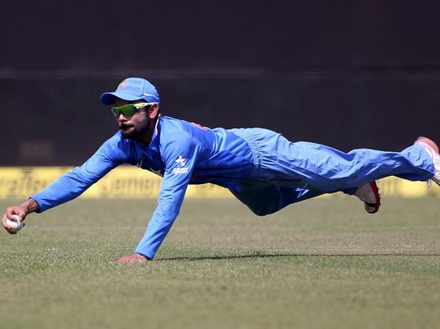 India's Virat Kohli dives to stop a ball during South Africa’s innings. (Reuters Photo)