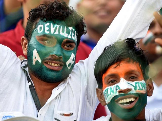 Spectators cheer ahead of the start of the match. (AFP Photo)