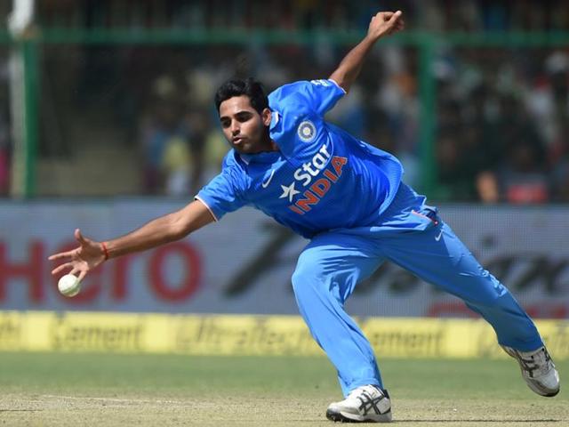 India's Bhuvneshwar Kumar fields off his own bowling during the first innings. (AFP Photo)