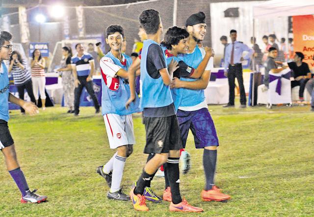 Team members celebrate a goal on Saturday. (Abhinav Saha/HT Photo)